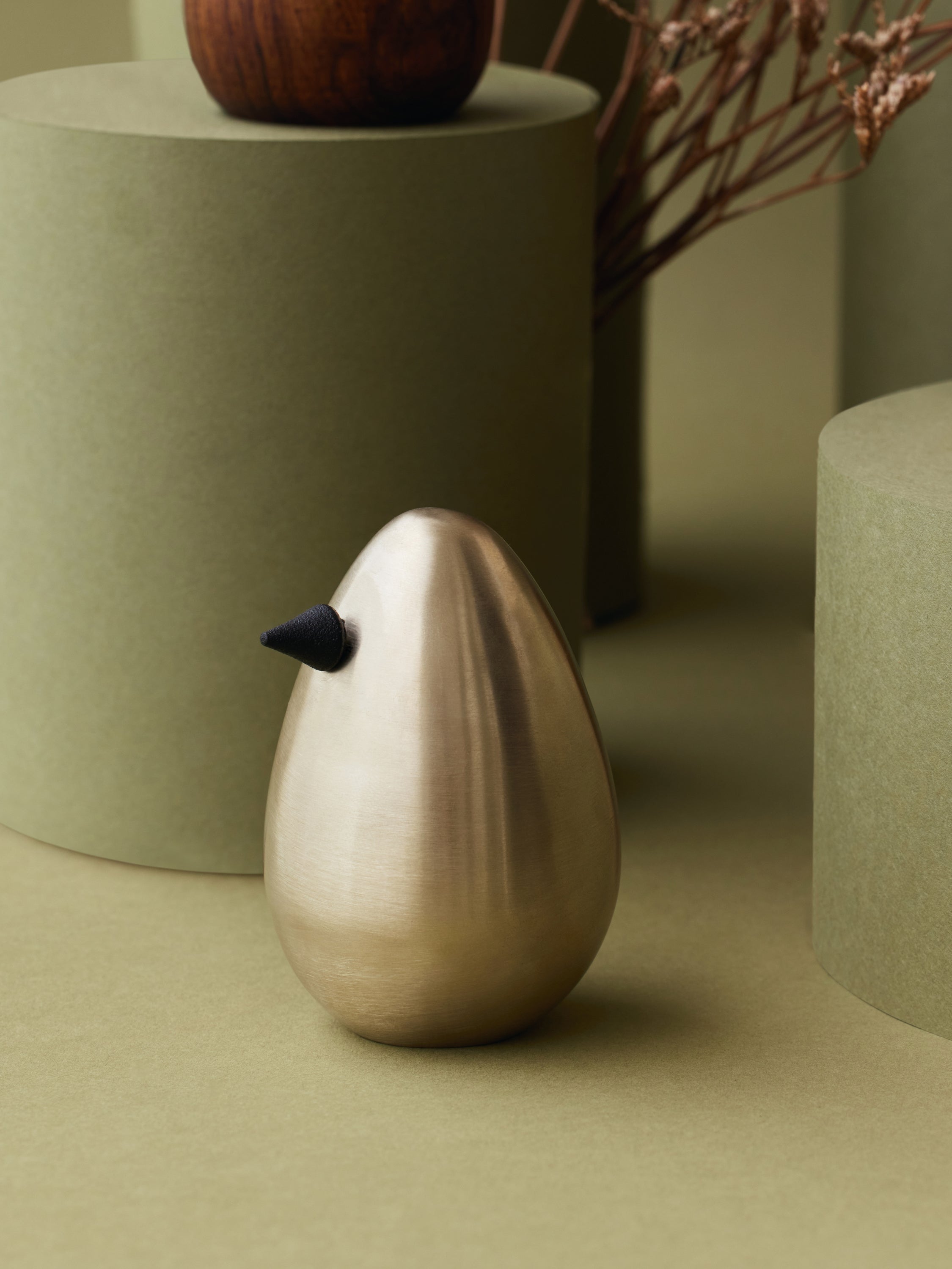 Brass minimal bird decor pieces.