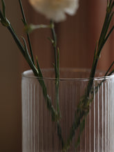 Fluted glass vase with gold plate.