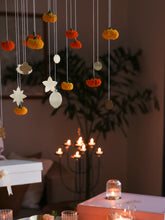 Foliage brass hangings in focus