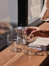 Stackable Glass Tumblers with one in hand