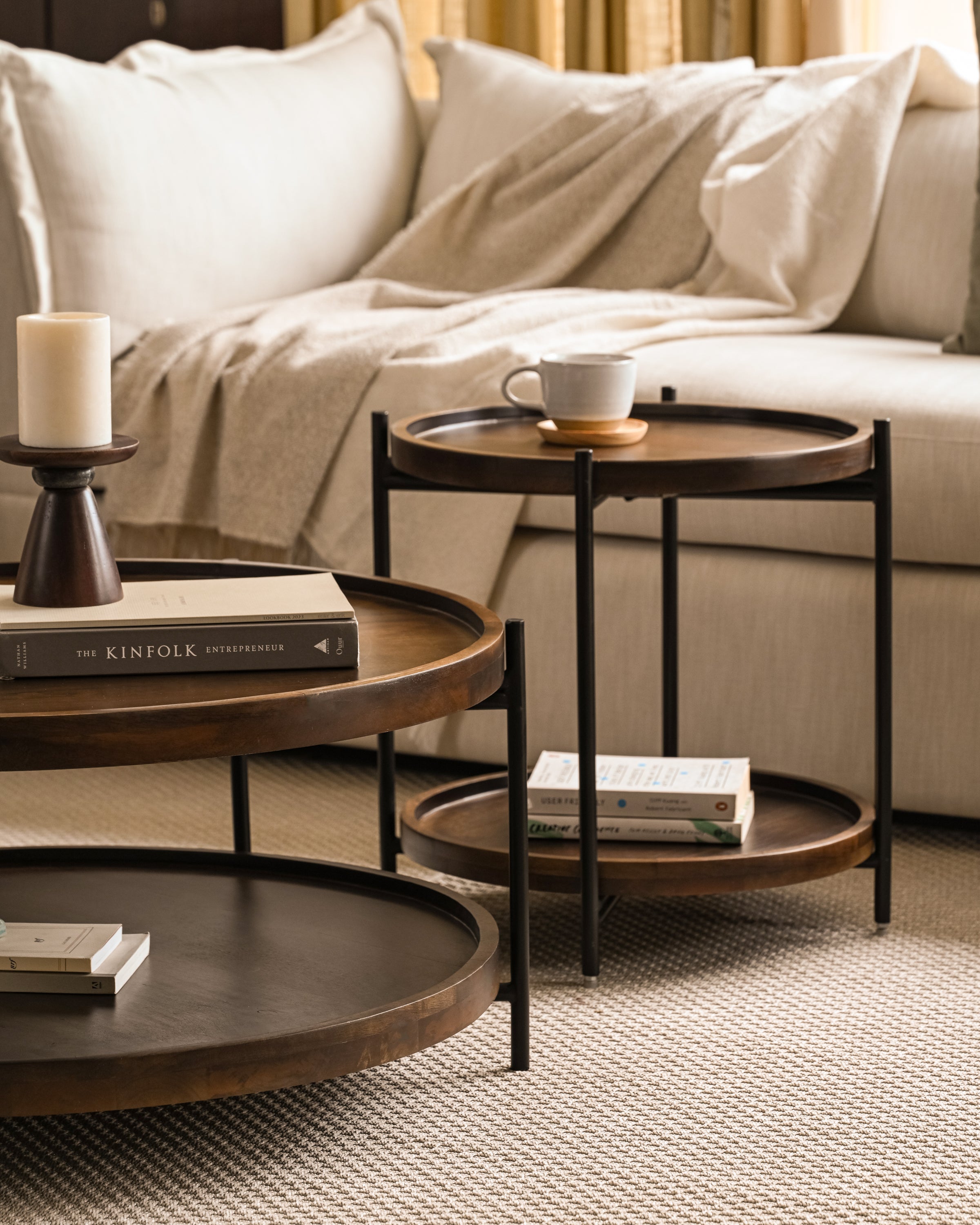 Functional round coffee table with shelf, perfect for minimalist interiors.