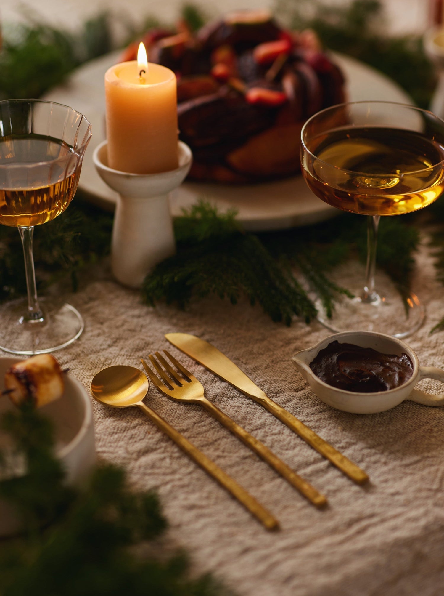 Spoon, fork and knife set in brass.