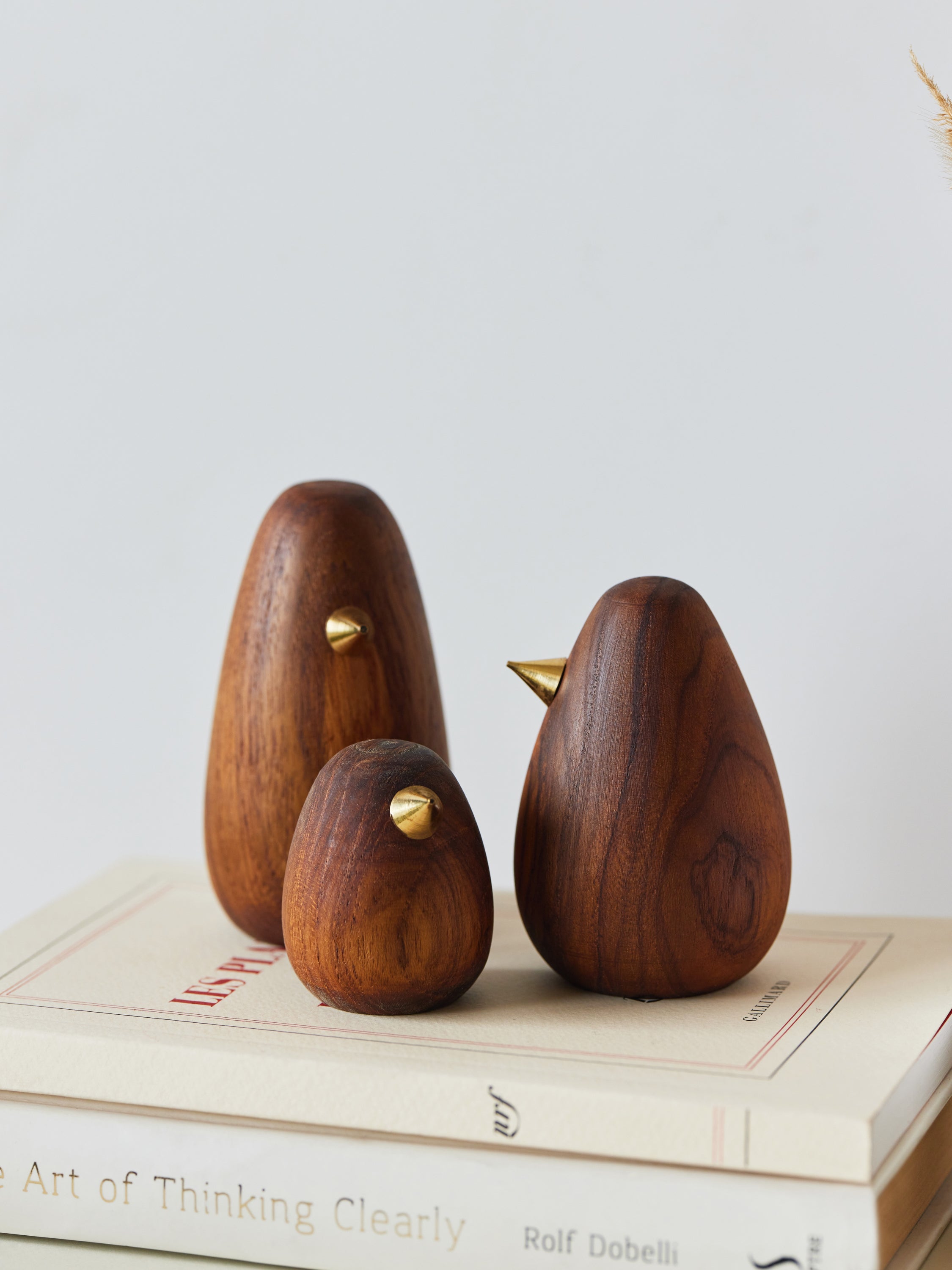 Wood bird figurine family with metal beak