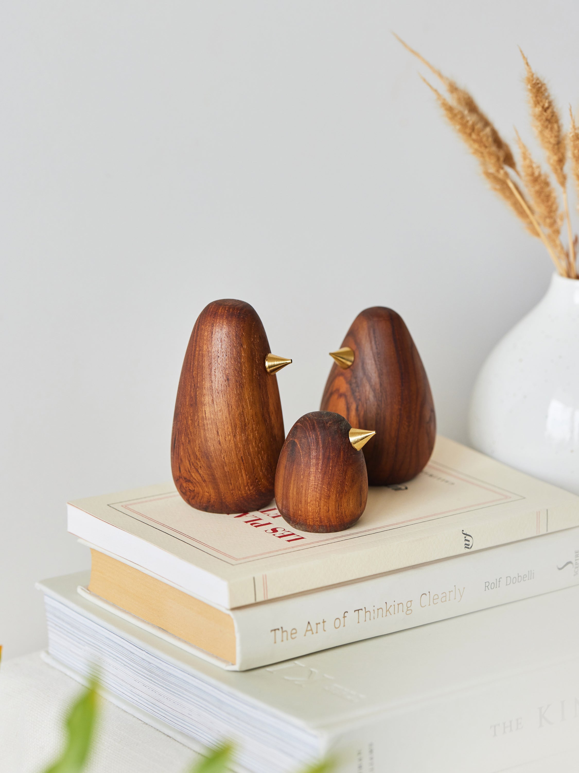 Wood bird figurine family with metal beak for living room decoration.