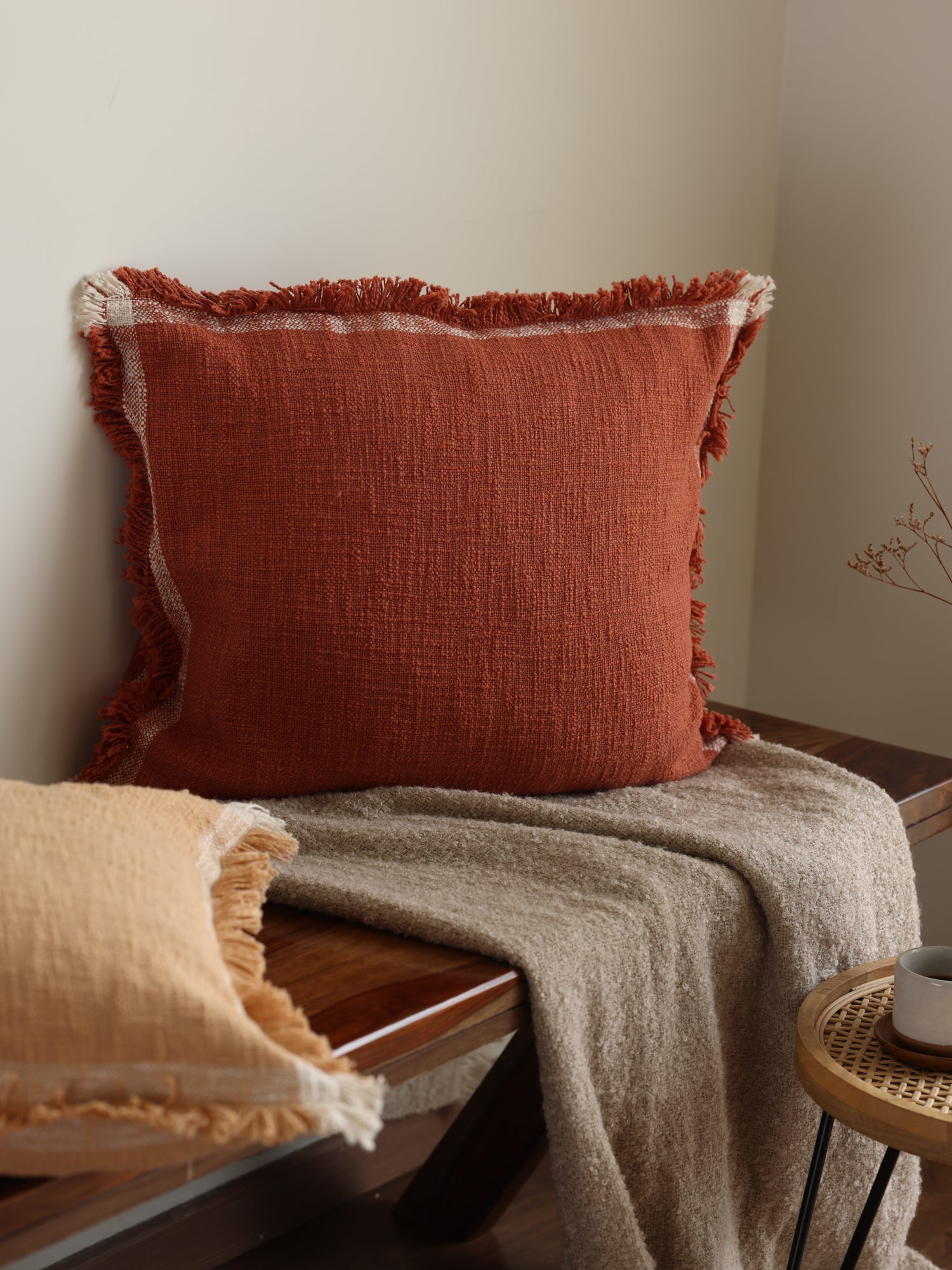 Woven cushion covers baked clay.