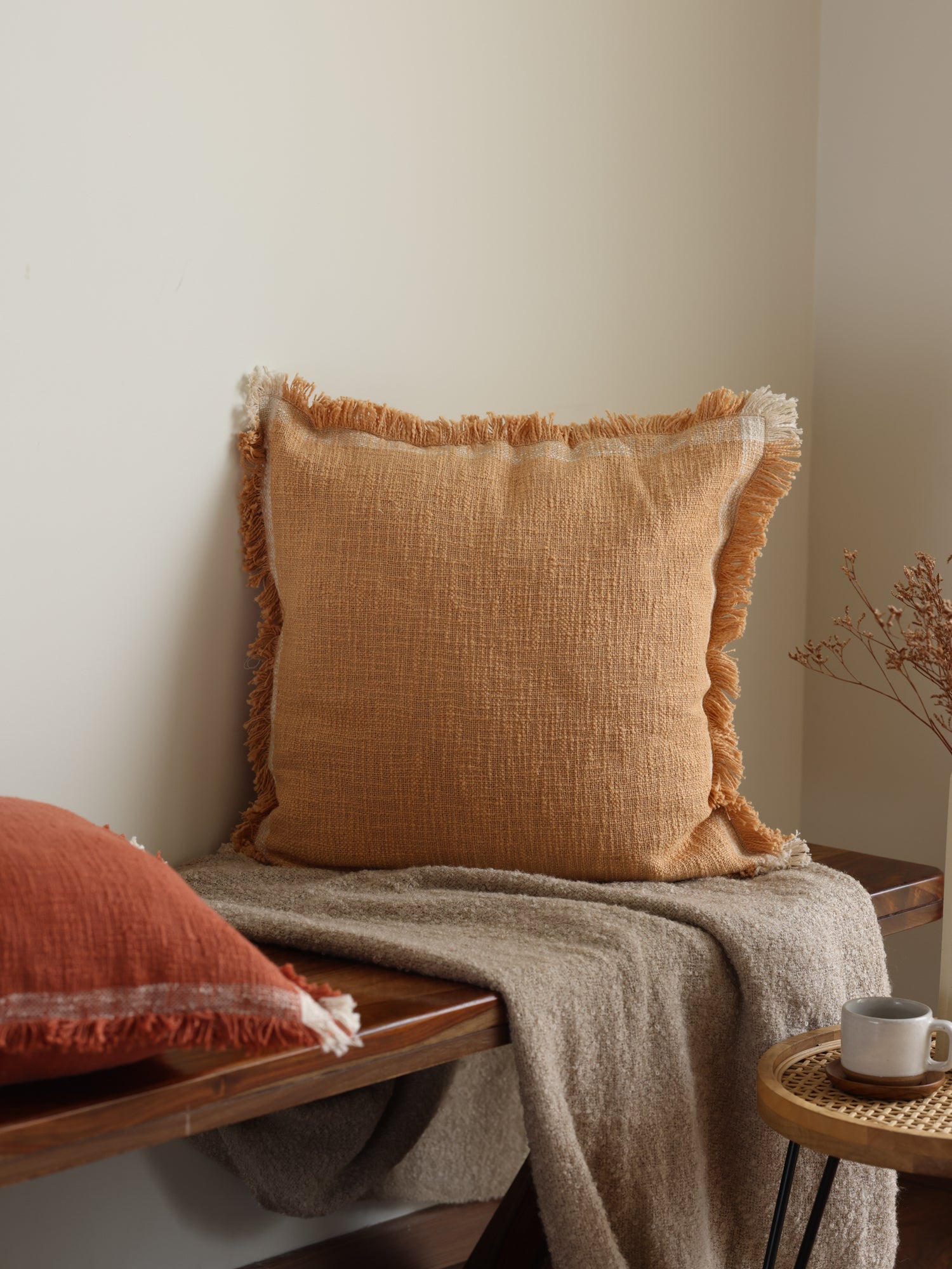 Woven textured cushion cover.