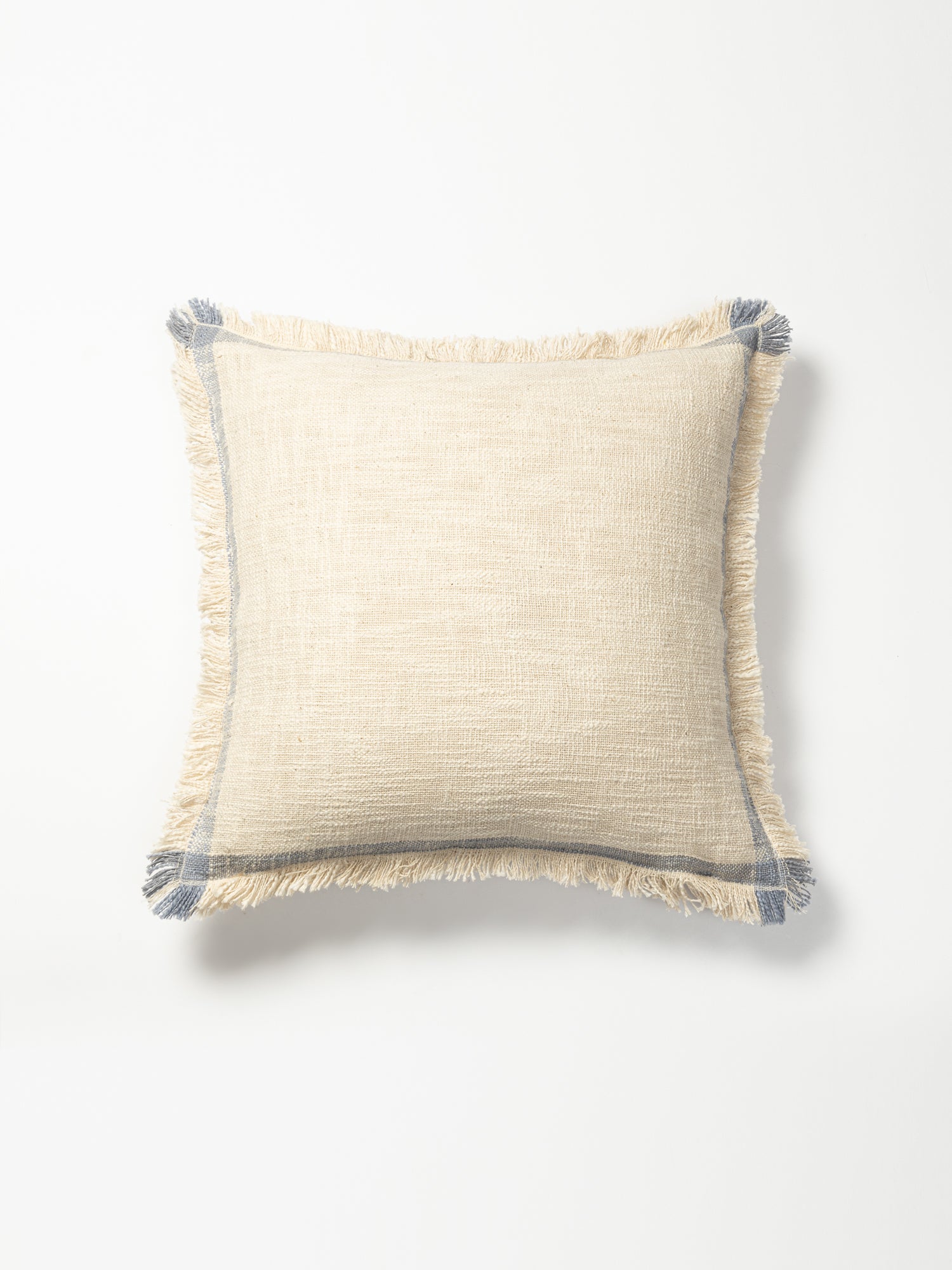 Cushion cover in white and blue.