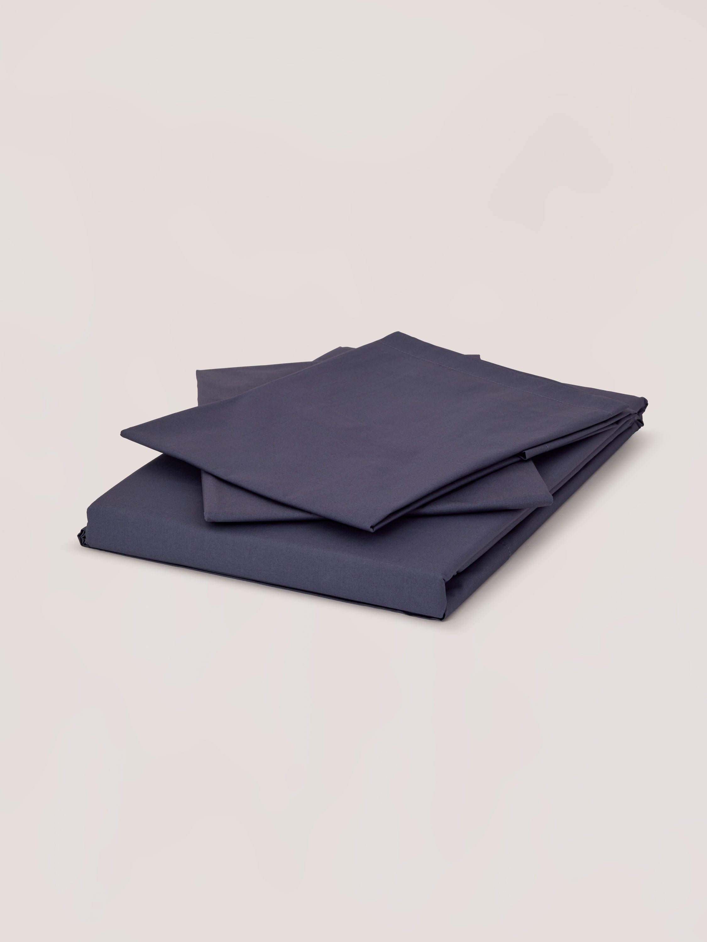 Blue bedsheet with pillowcase.