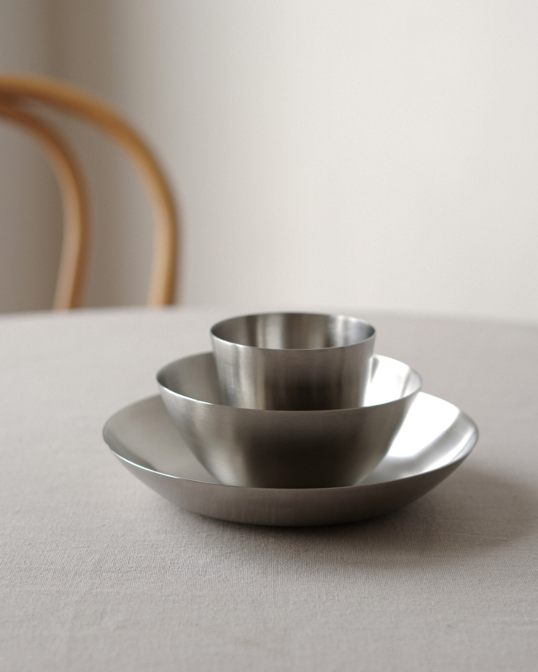 Fuji steel tumbler, bowl and pasta plate nested.