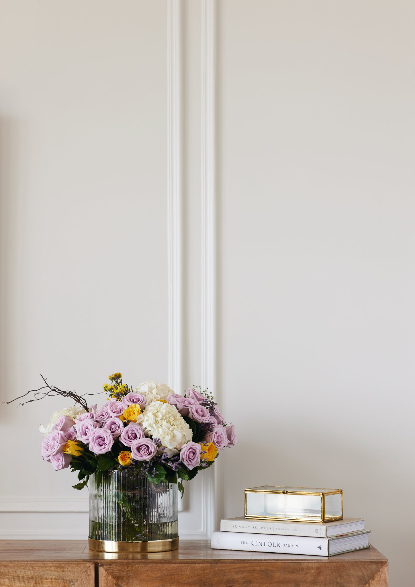Fluted glass flower vase with gold metal base decorated