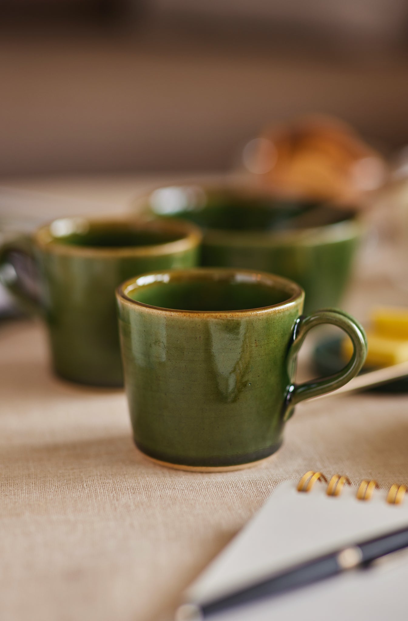 green ceramic Coffee mugs by fleck