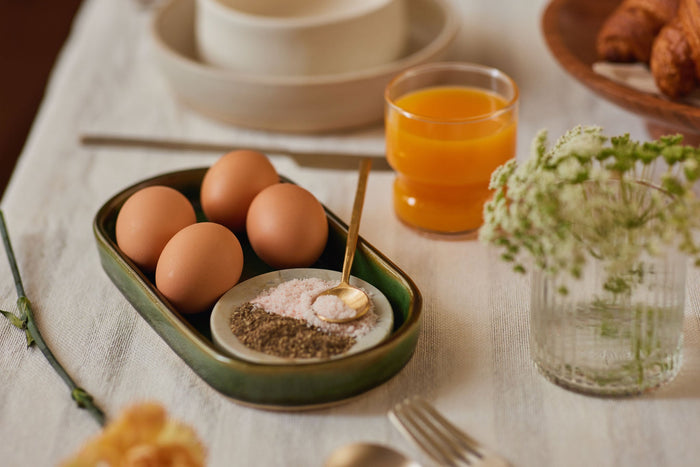 boiled eggs in a breakfast tray on a  table