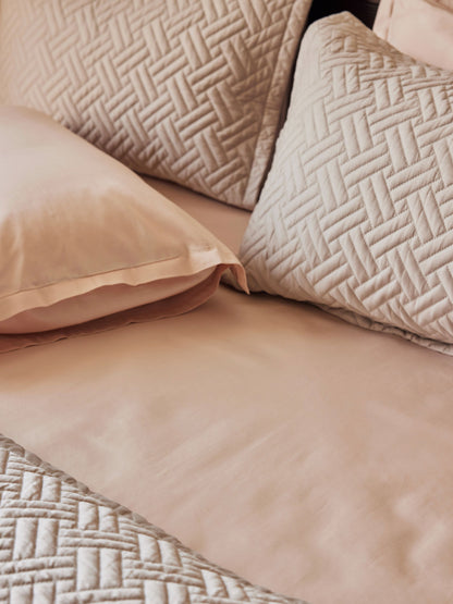 Blush Percale Sheet with basketweave quilts