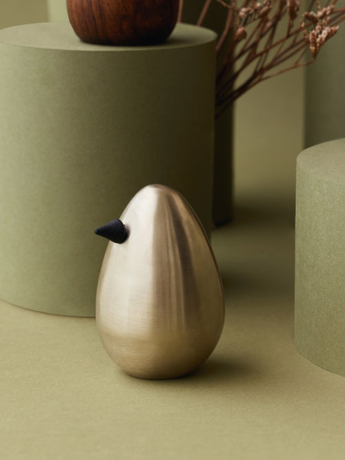 Brass minimal bird decor pieces.