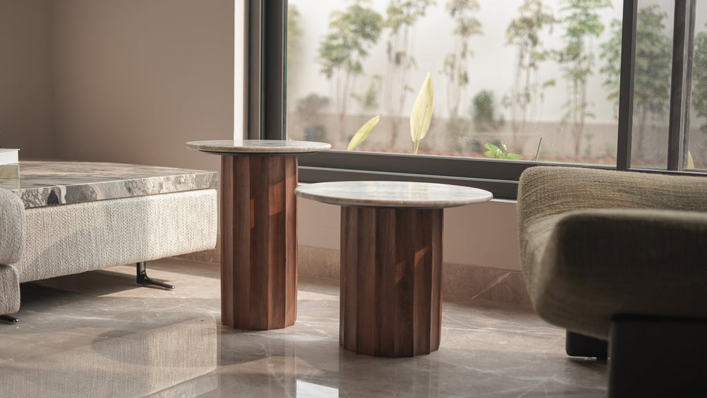 Modern living room with wooden side tables and a sofa.