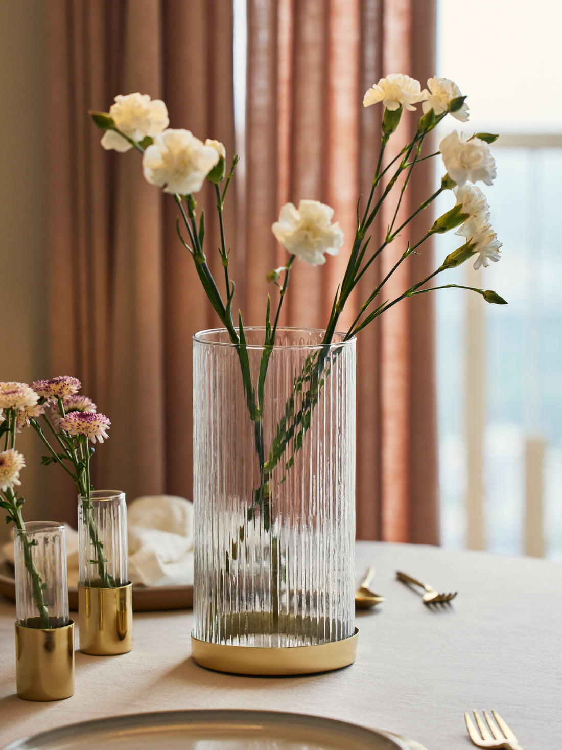 Tall glass vase for decor.