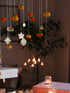 Foliage brass hangings in focus