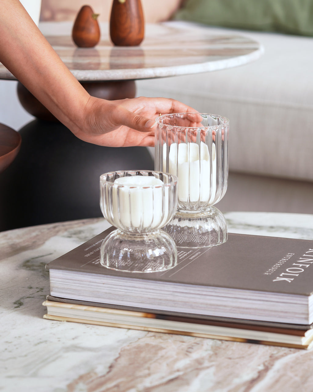 Pair of clear textured glass candle holders with minimalist white candles – perfect for cozy ambiance.