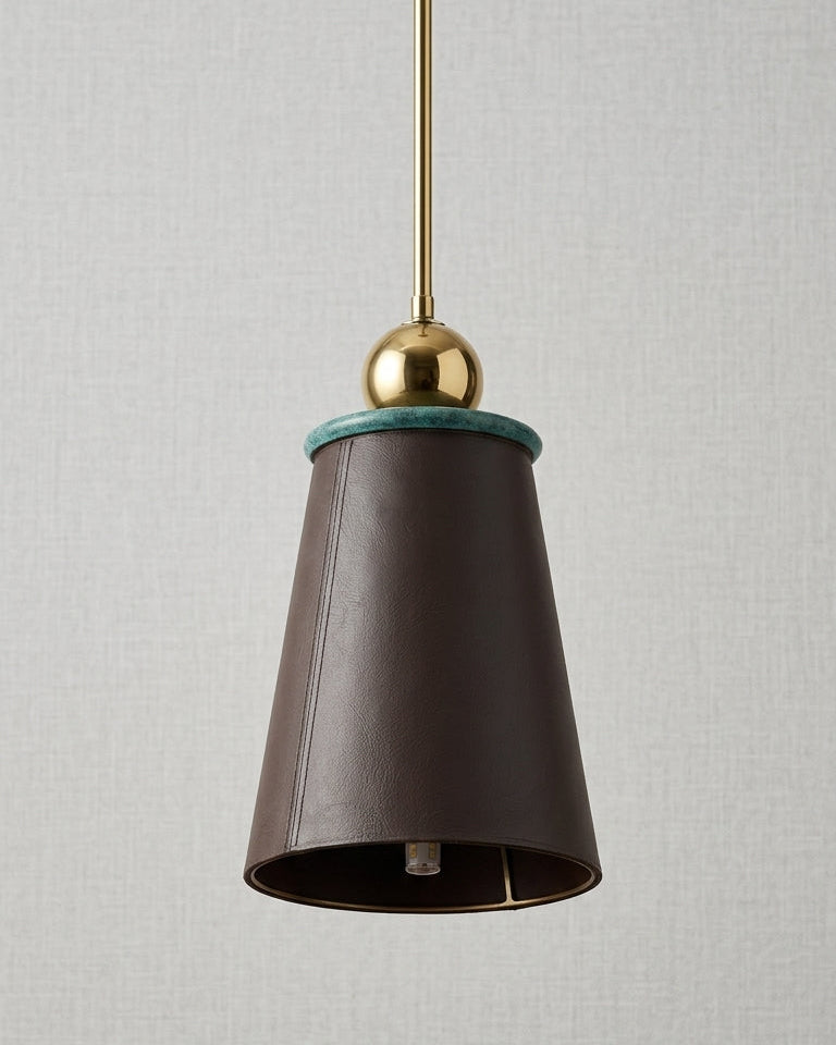 Pendant light with brown shade and gold fixture on a neutral background
