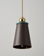 Pendant light with brown shade and gold fixture on a neutral background