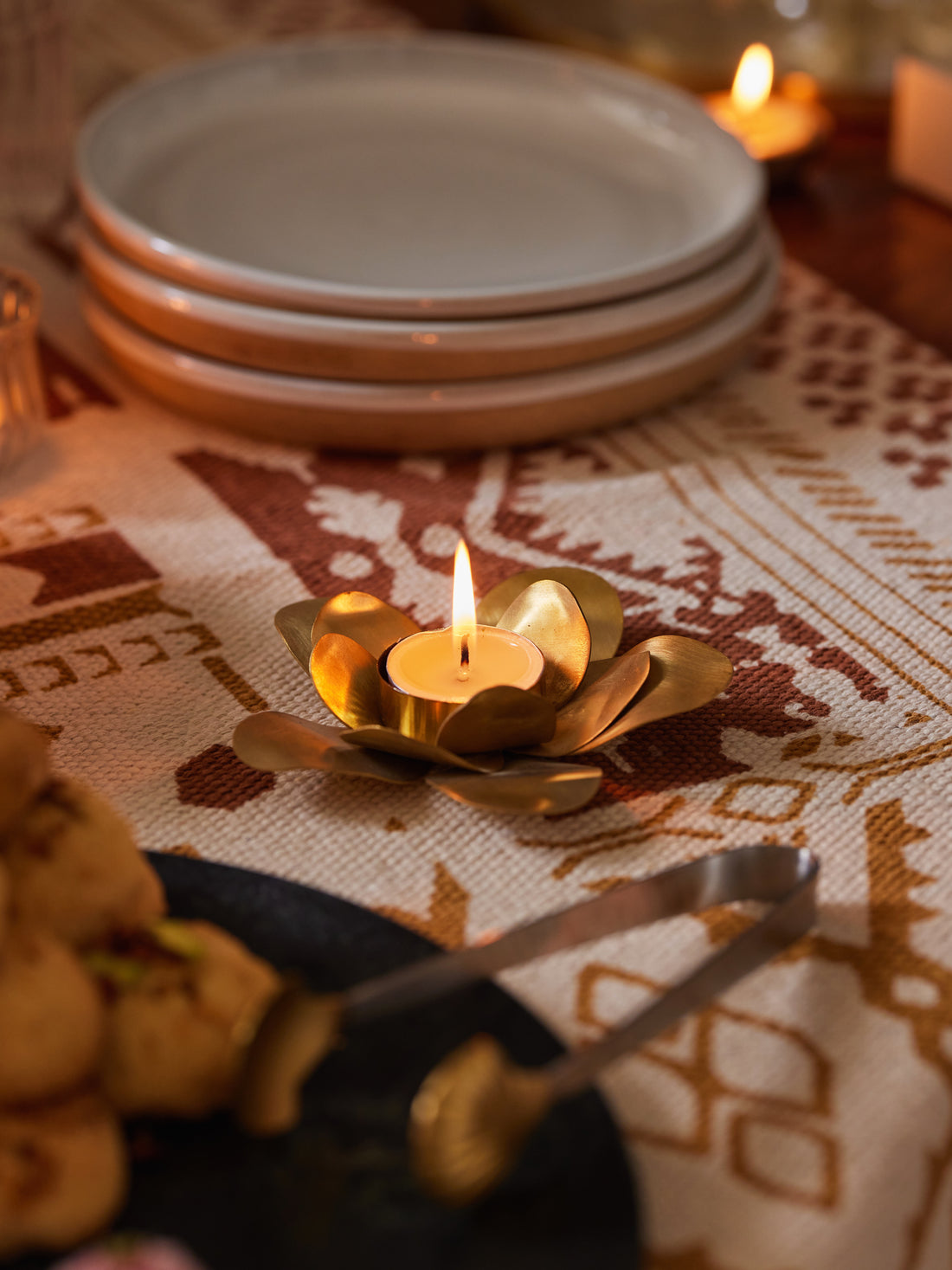 Handmade brass lotus tealight holder with hand-molded petals, crafted in India