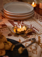 Handmade brass lotus tealight holder with hand-molded petals, crafted in India