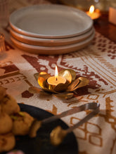 Handmade brass lotus tealight holder with hand-molded petals, crafted in India