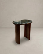Small side table with marble top and wooden base on a plain background
