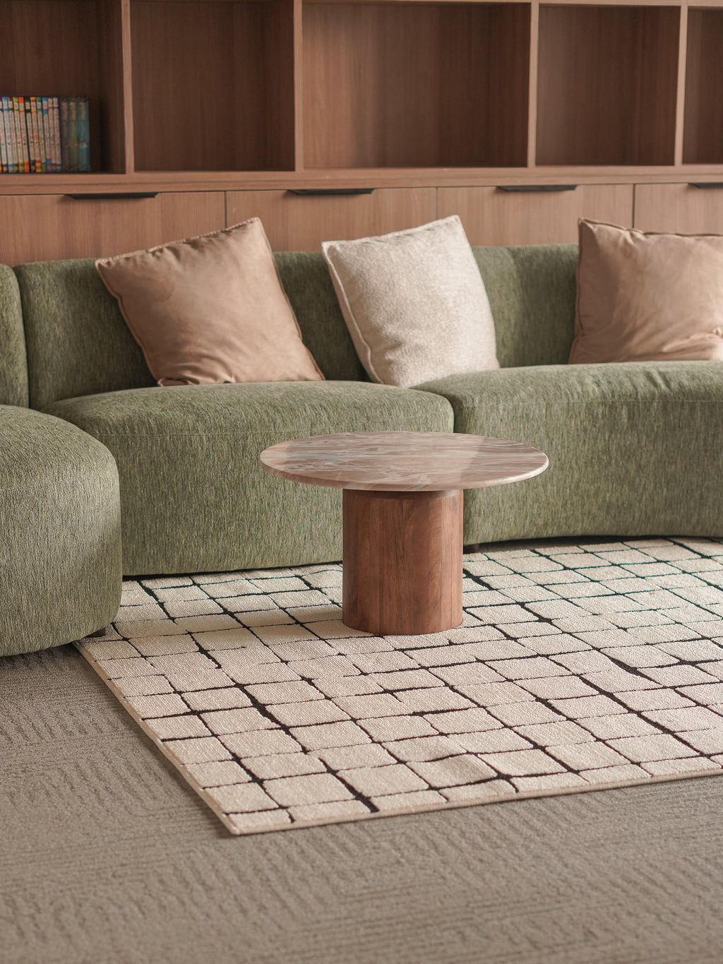 Marble round coffee table in a modern living room setting.