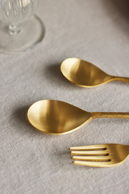 Gold cutlery set for dining.