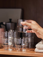 Stackable Tumblers with one glass tumbler in hand