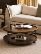 Round wooden table with living room setup 