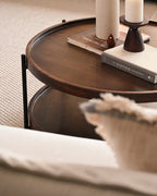 Closeup of the small coffee table with black metal frames.
