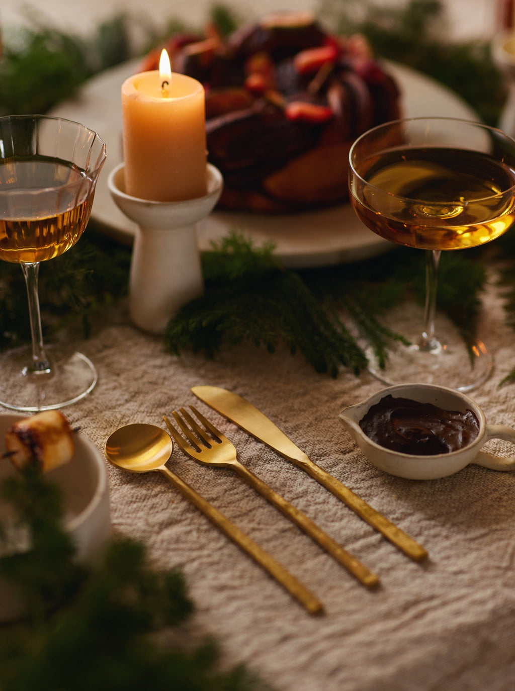 Spoon, fork and knife set in brass.