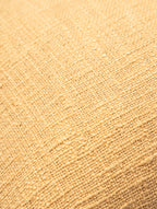 Woven beige and white cushion cover.