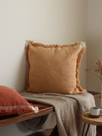 Woven textured cushion cover.