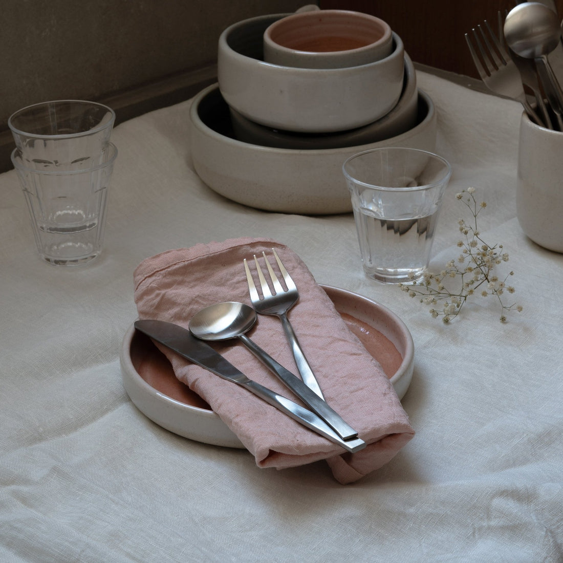 Wabi steel cutlery set by fleck with ceramic plates